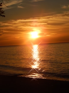A breathtaking sunset over the tranquil ocean waves.