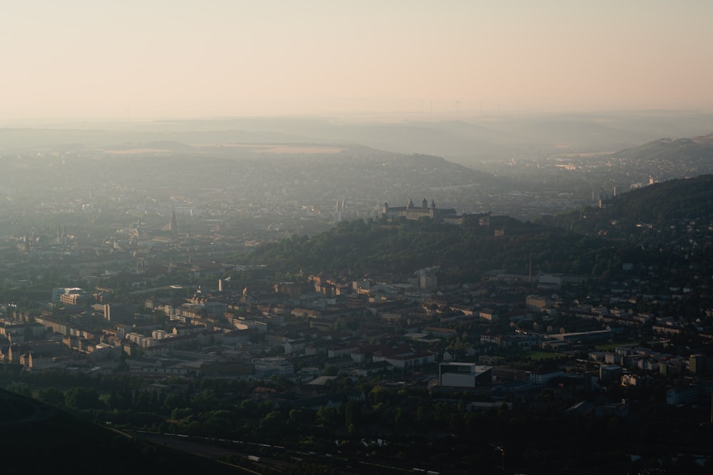 a city with a body of water in the background