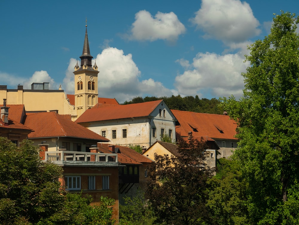 a group of buildings with trees in front of them