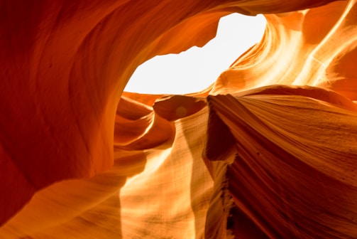 A guide explaining the history and geology of Antelope Canyon to visitors.