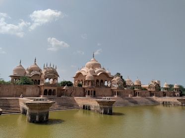 a body of water with a building in the background