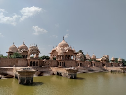 a body of water with a building in the background