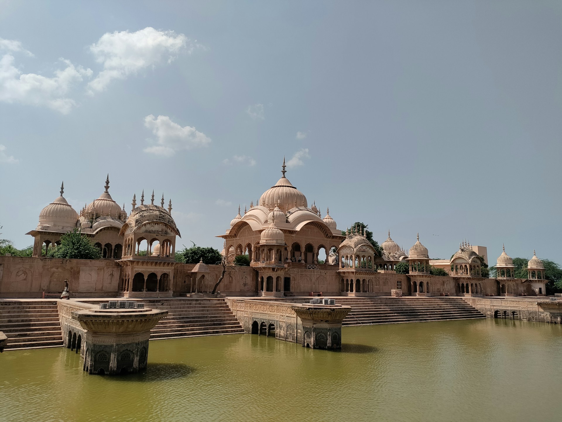 a body of water with a building in the background