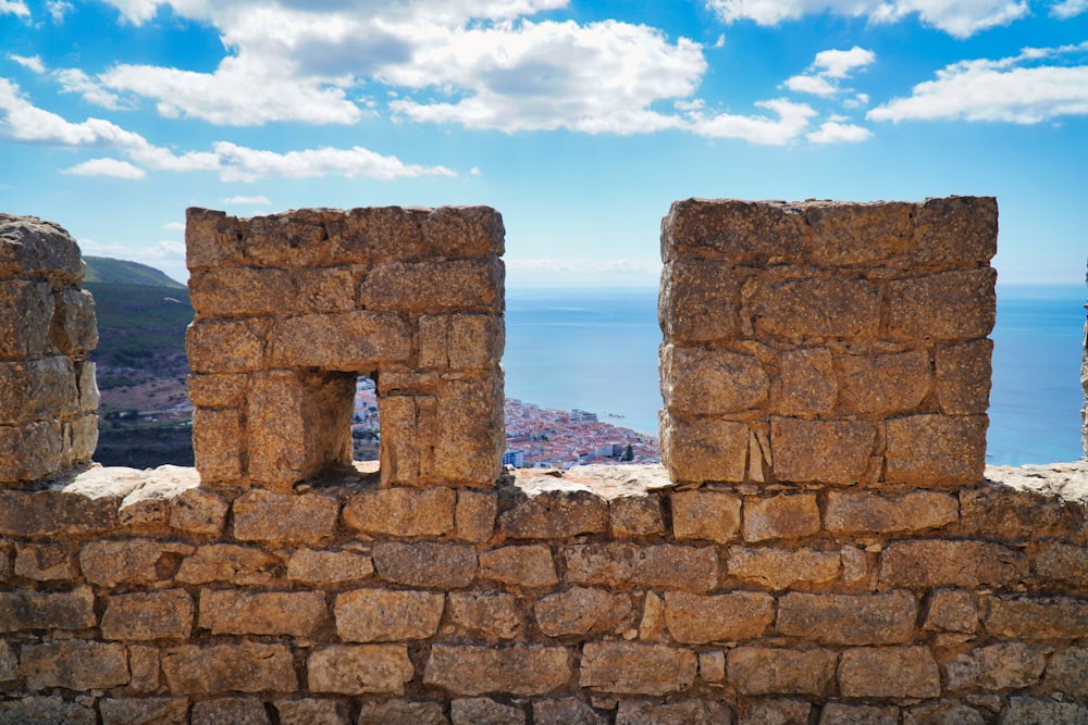 a stone wall with a stone arch