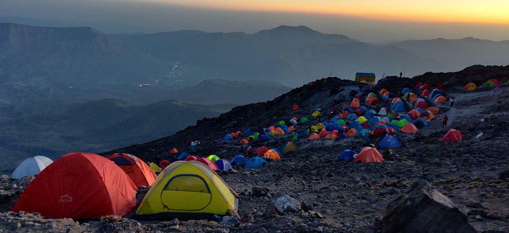 a group of tents on a mountain