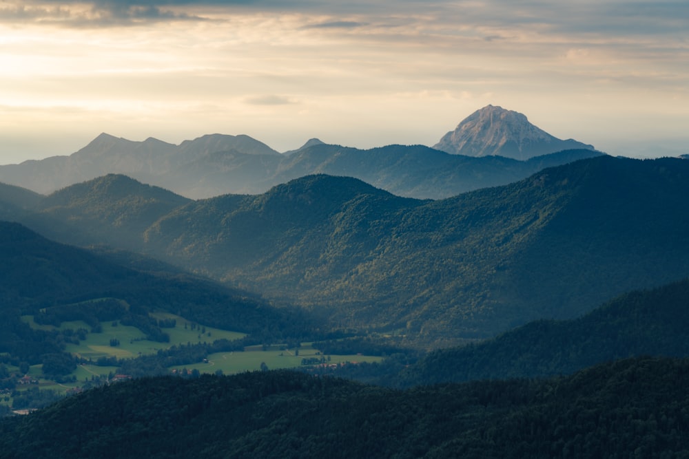 a valley with mountains in the background