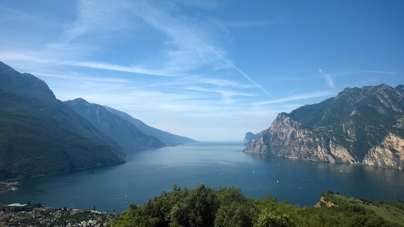 Lake Garda framed by mountains, seen from above Riva del Garda