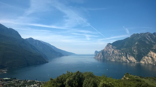 Lake Garda framed by mountains, seen from above Riva del Garda