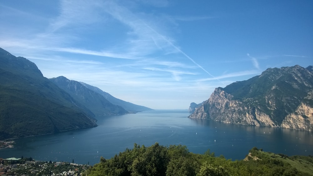 a body of water surrounded by mountains with Doubtful Sound in the background