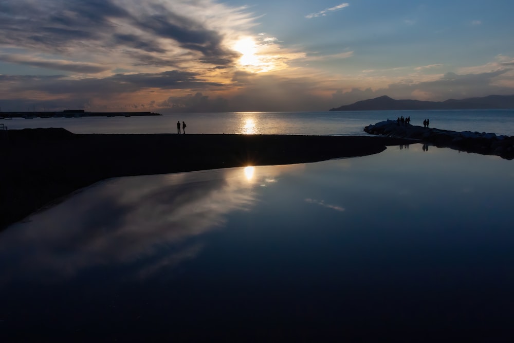 a body of water with a sunset