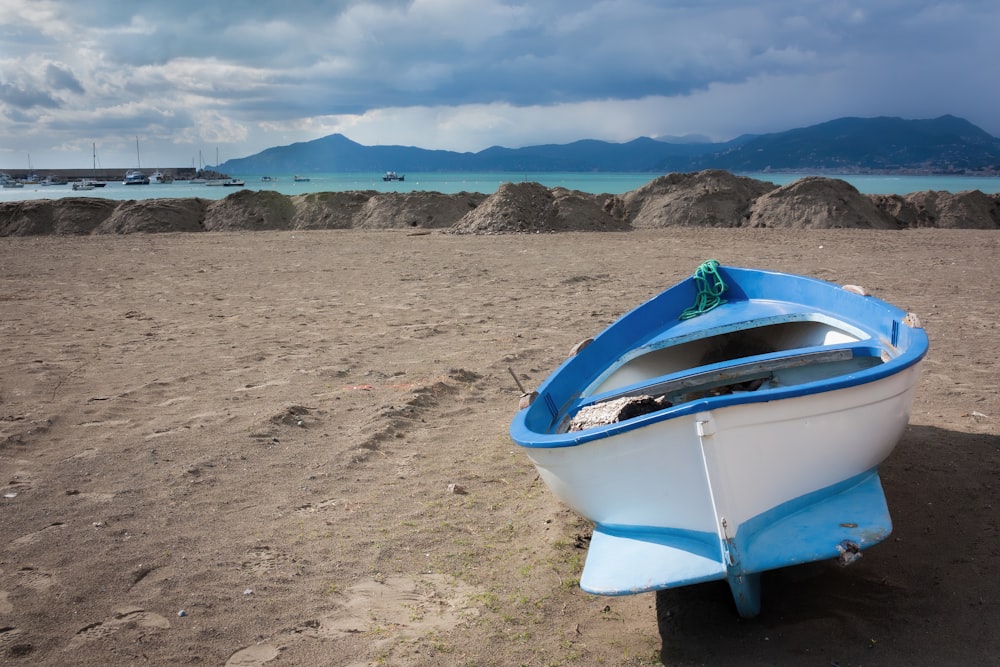 a blue bucket on a beach