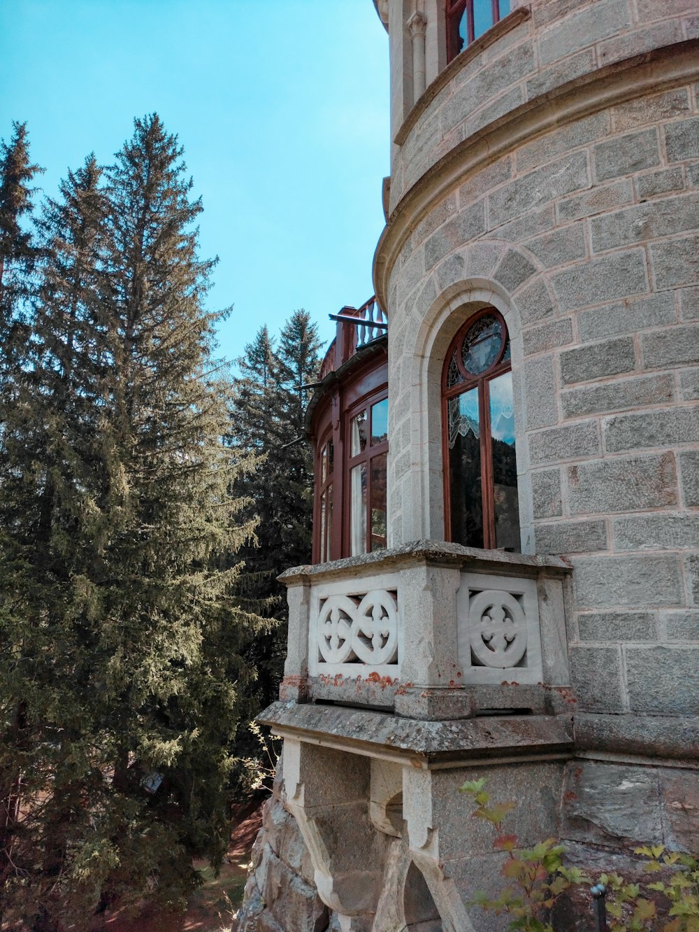 a stone building with a clock on it