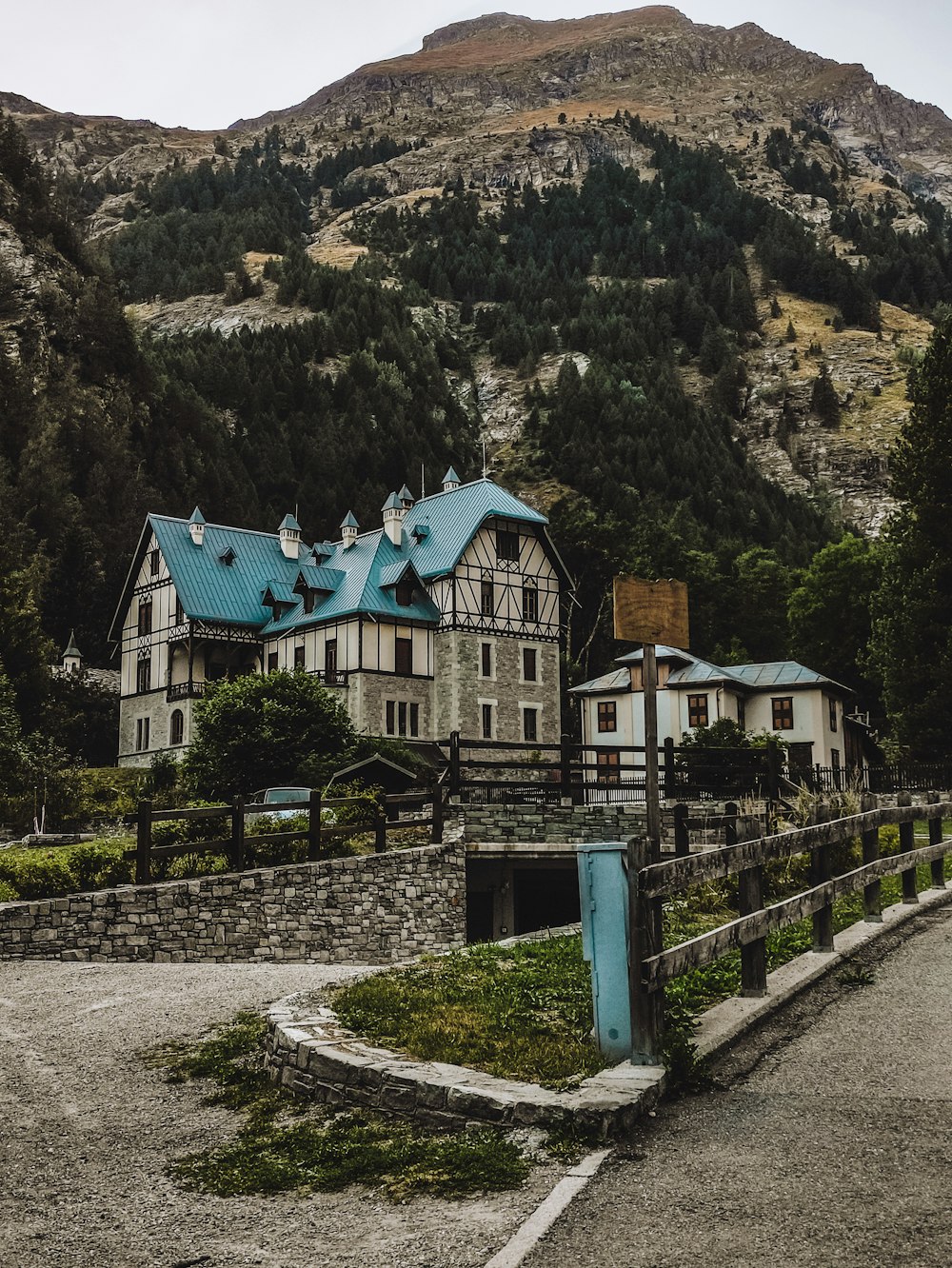 a large house with a blue roof