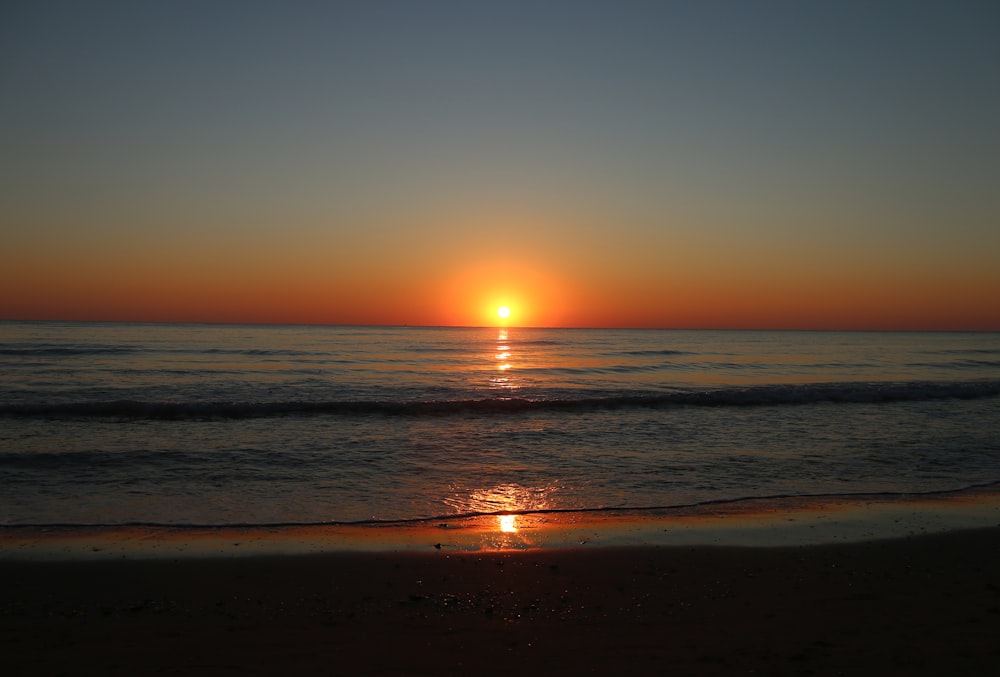 a sunset over the ocean