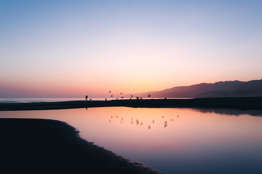 a body of water with a group of people on it