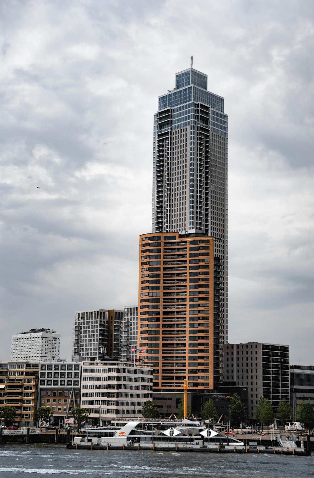 a tall building next to a body of water