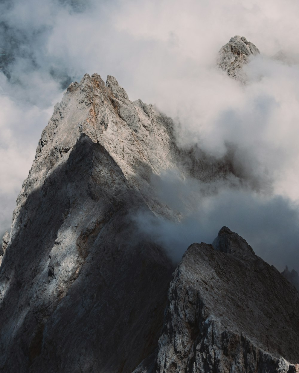 a mountain with clouds