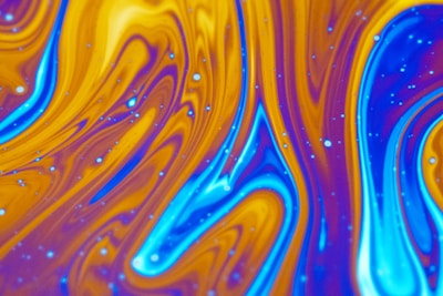 A vibrant orange and black abstract design representing energy and motivation.