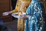 a person holding a plate of food