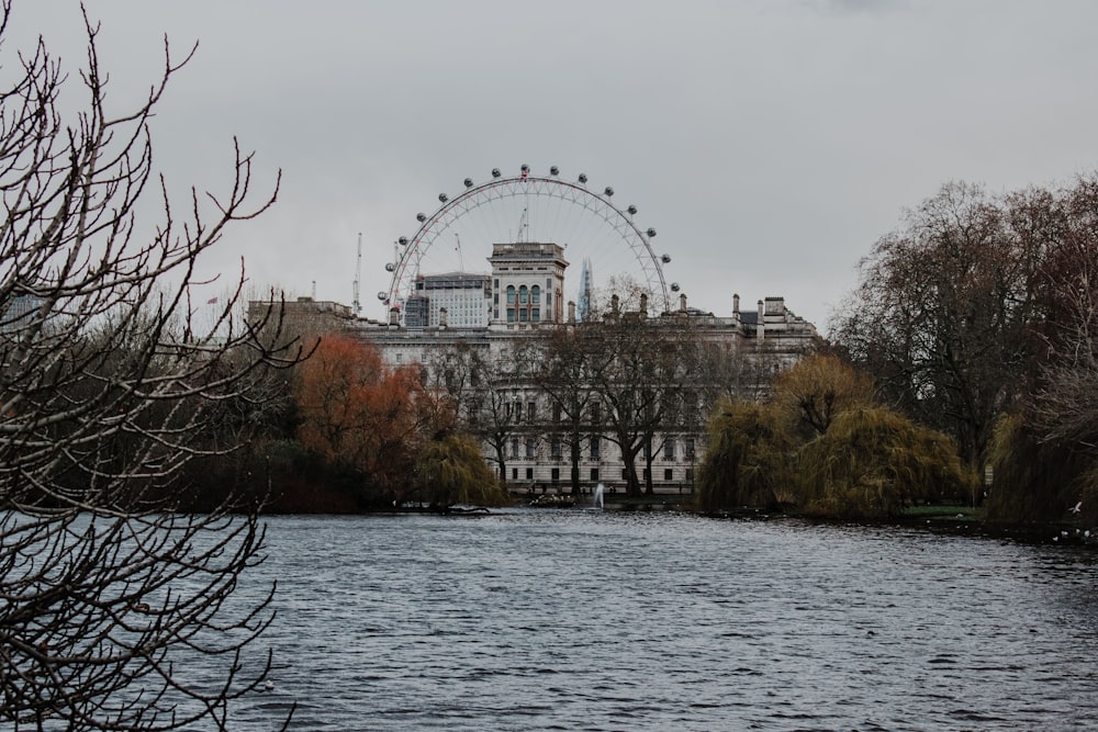 a body of water with a building in the background