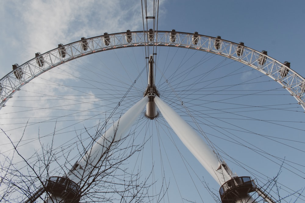 a ferris wheel with a cloudy sky