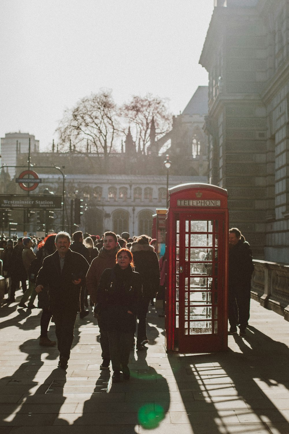 a group of people walking down a street