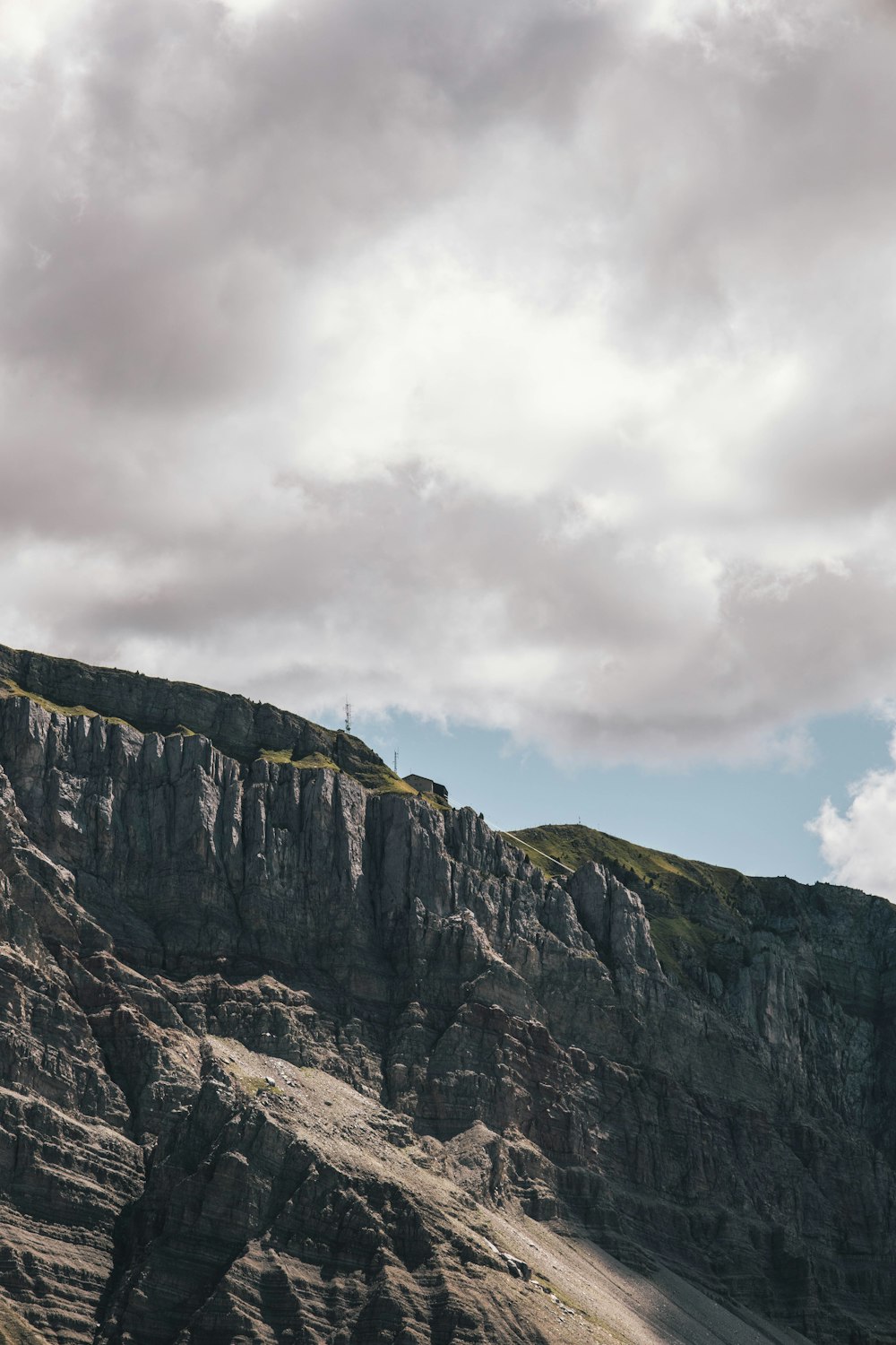 a rocky mountain with a road