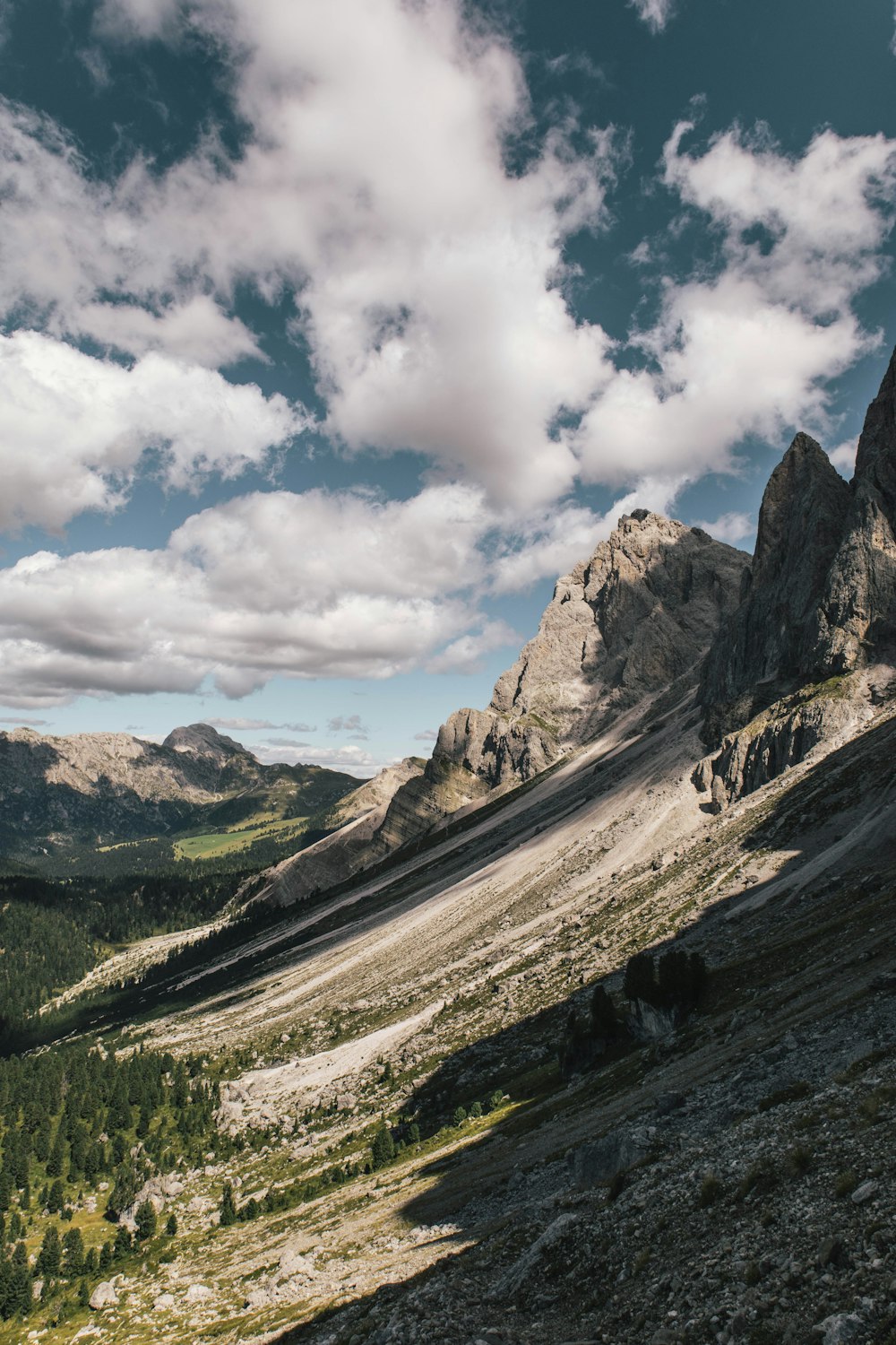 a rocky mountain with a valley below