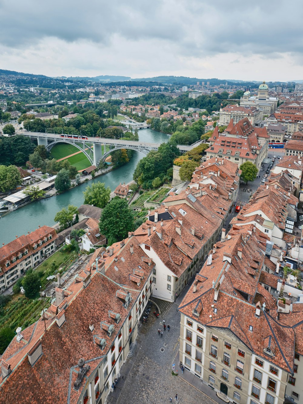 a river with a bridge and buildings