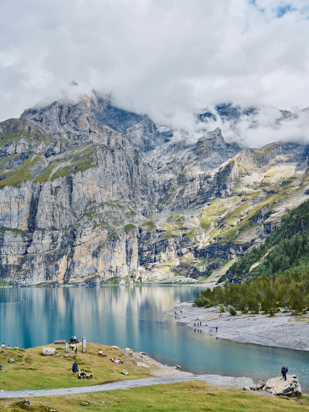 a body of water with a mountain in the background