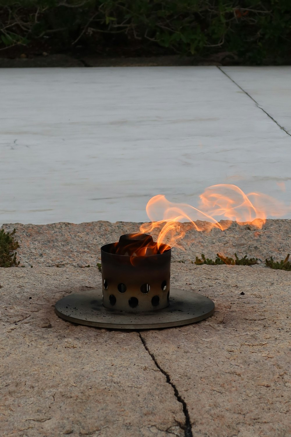 a fire pit with a flame