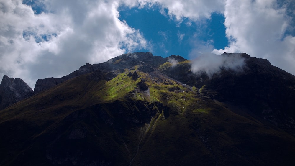 a mountain with clouds