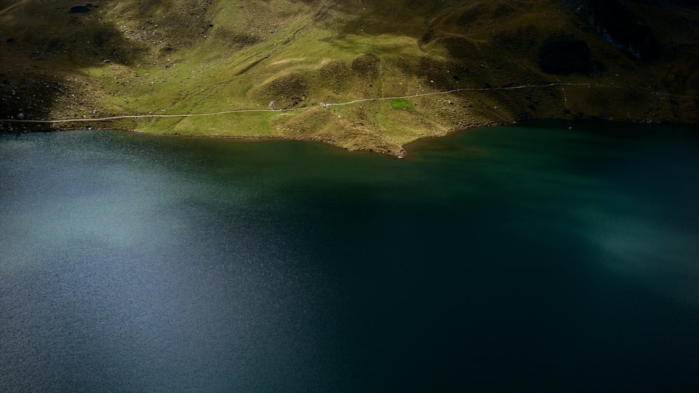 a body of water with land in the back