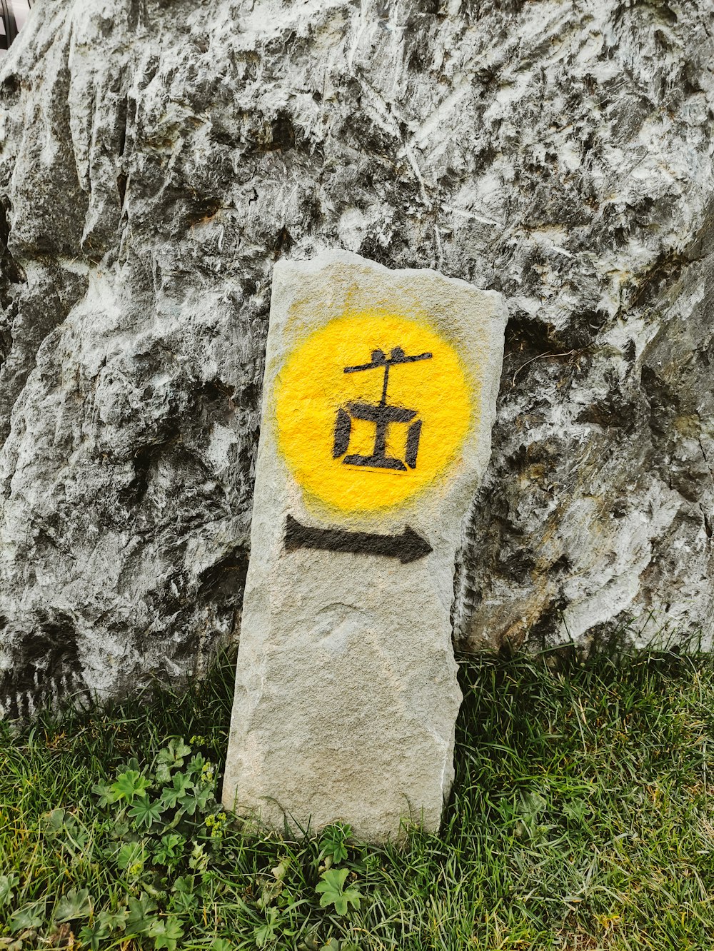 a rock with a face drawn on it
