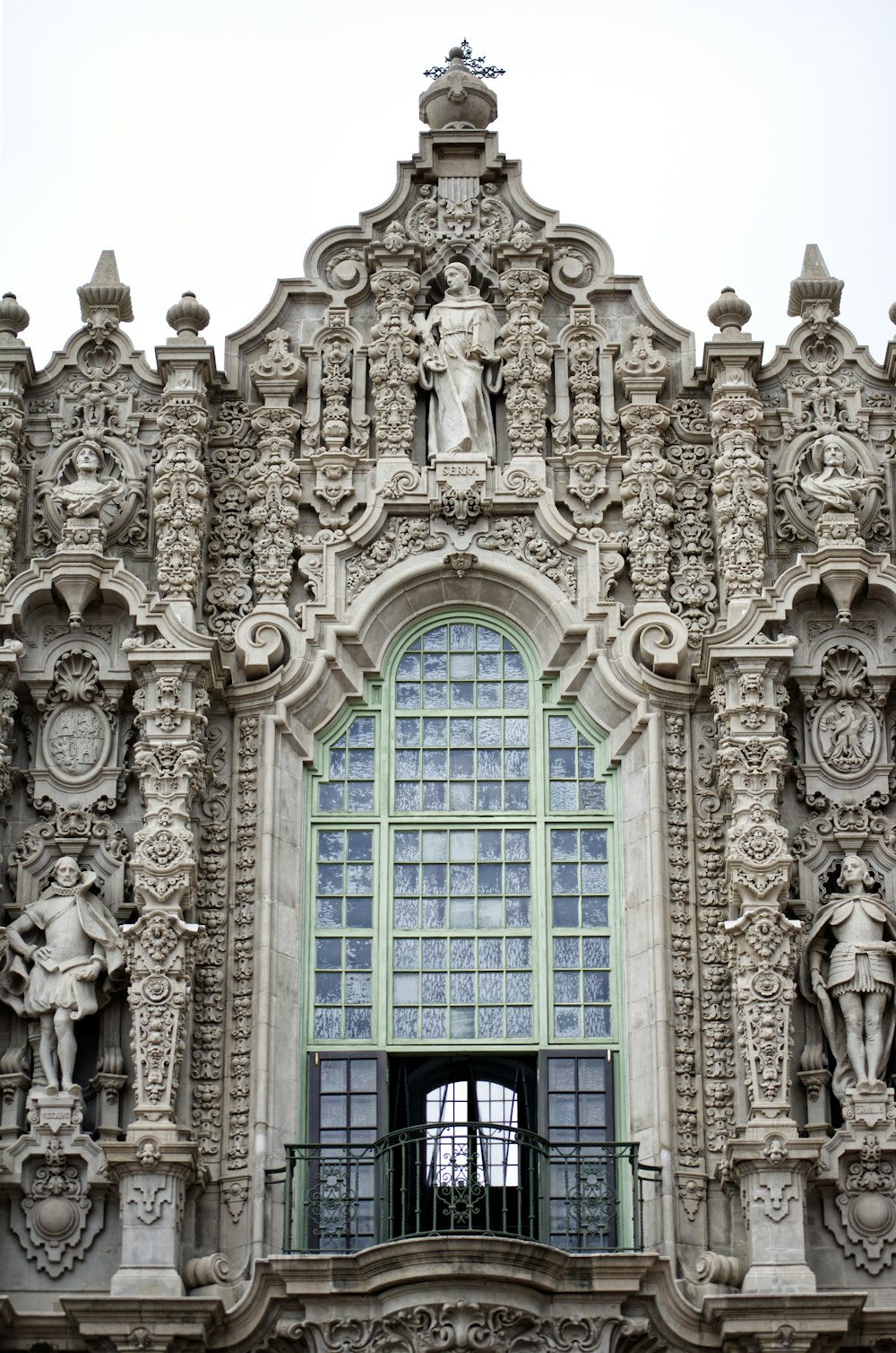 a building with statues on the front