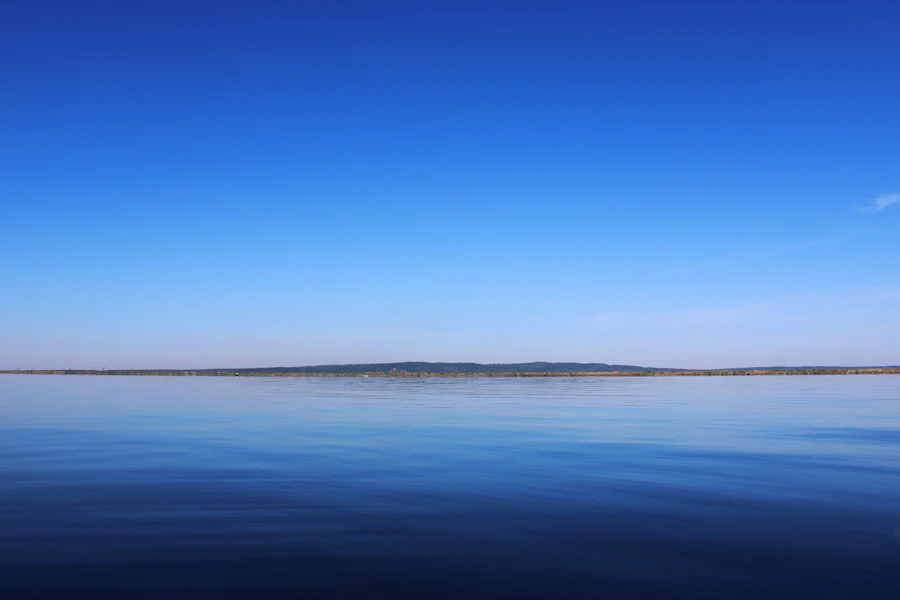 Calm blue water extending to a distant horizon