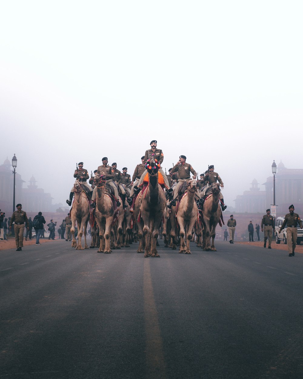 a group of men riding horses