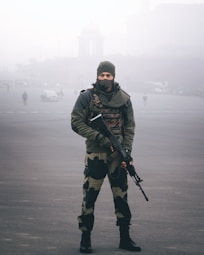 a man in a uniform holding a gun