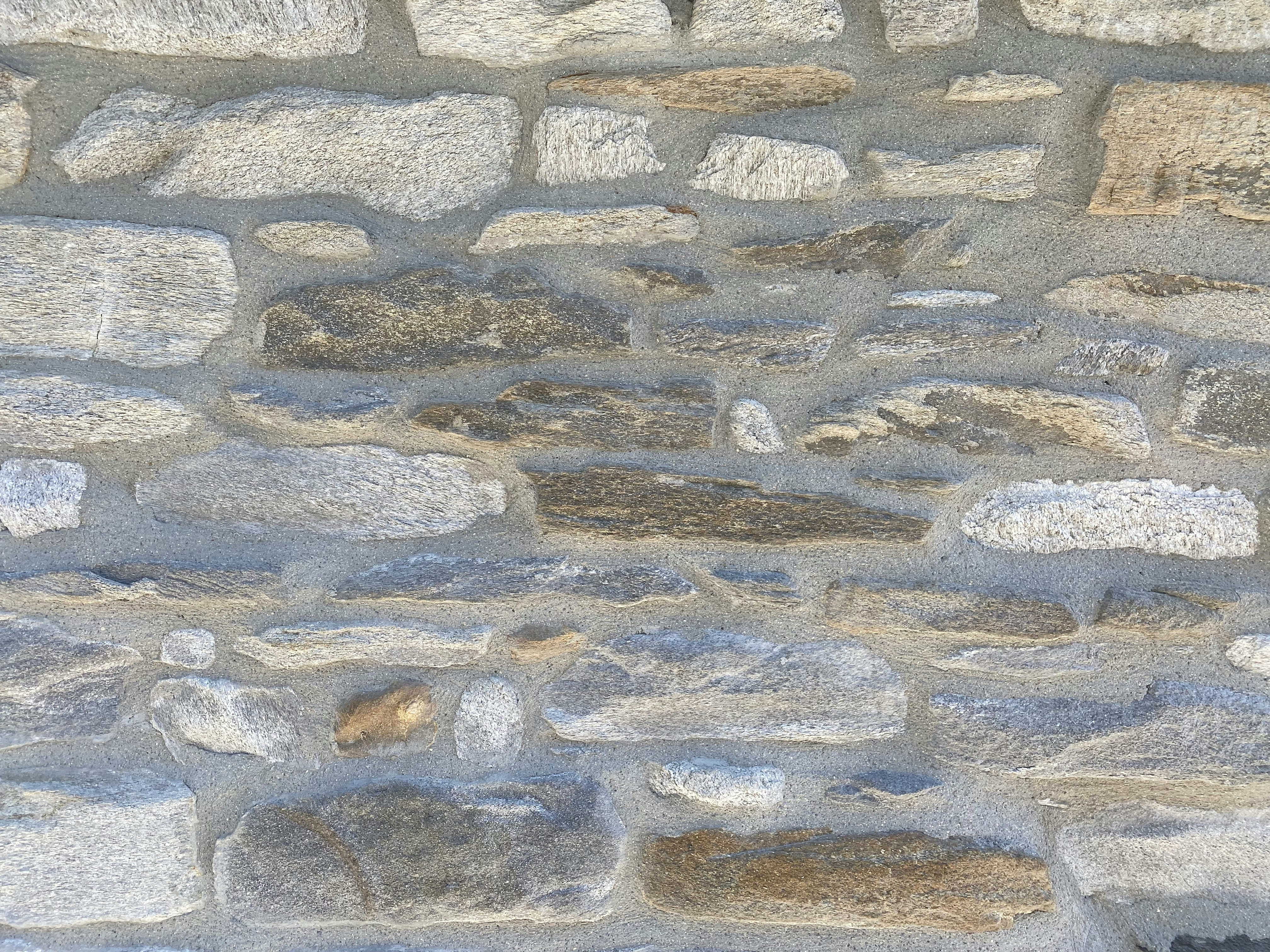 Brick wall in Paris, France. Old stones.