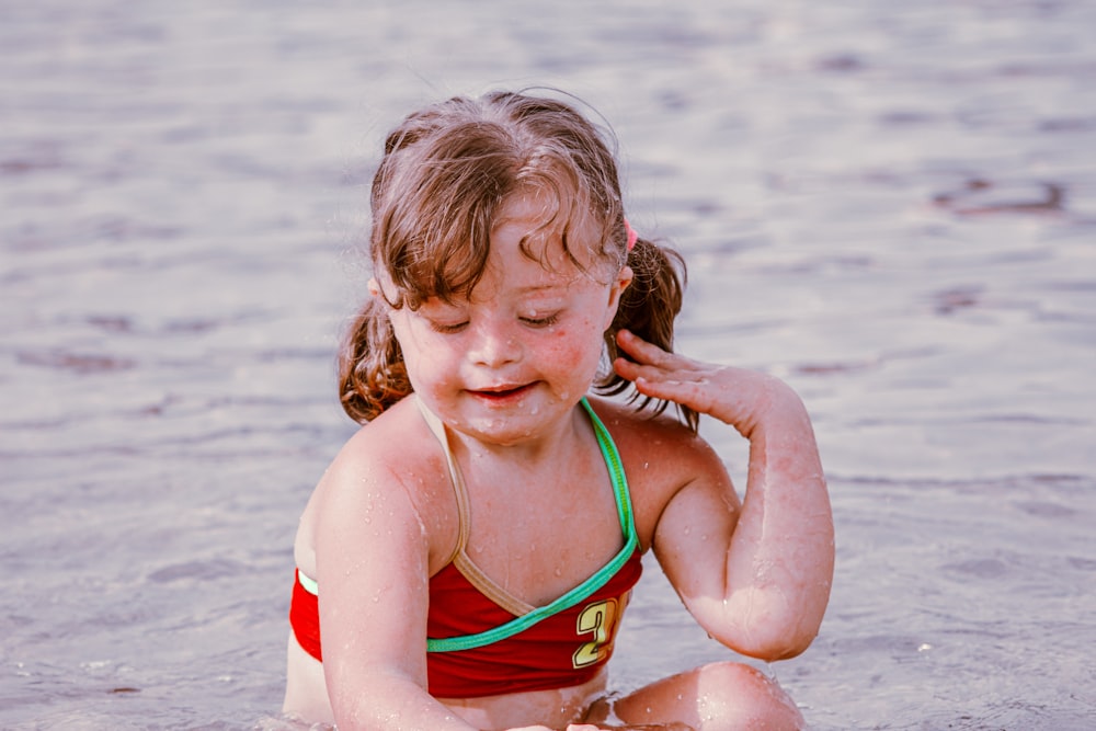 a girl in a swimsuit in the water