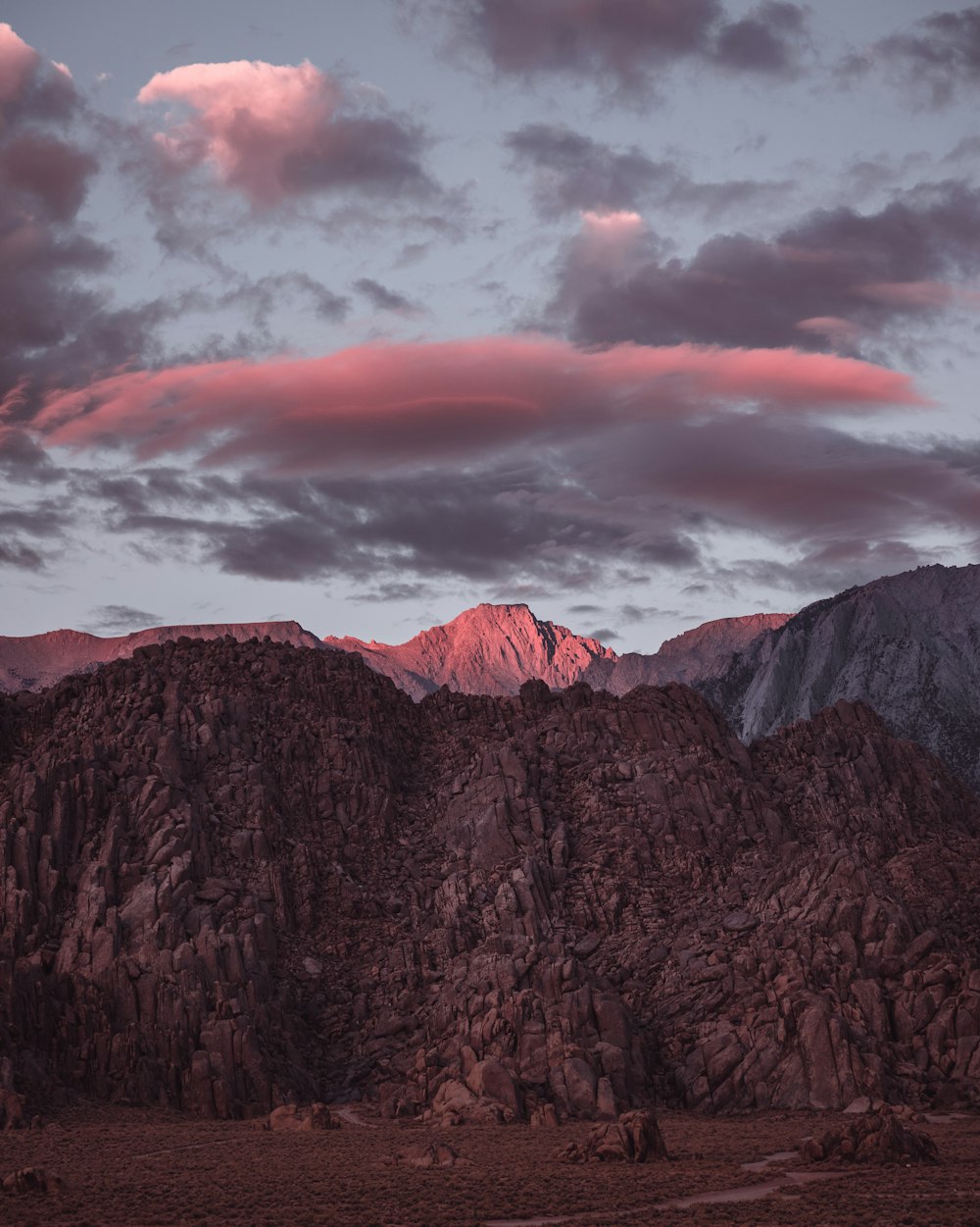 a mountain range with clouds