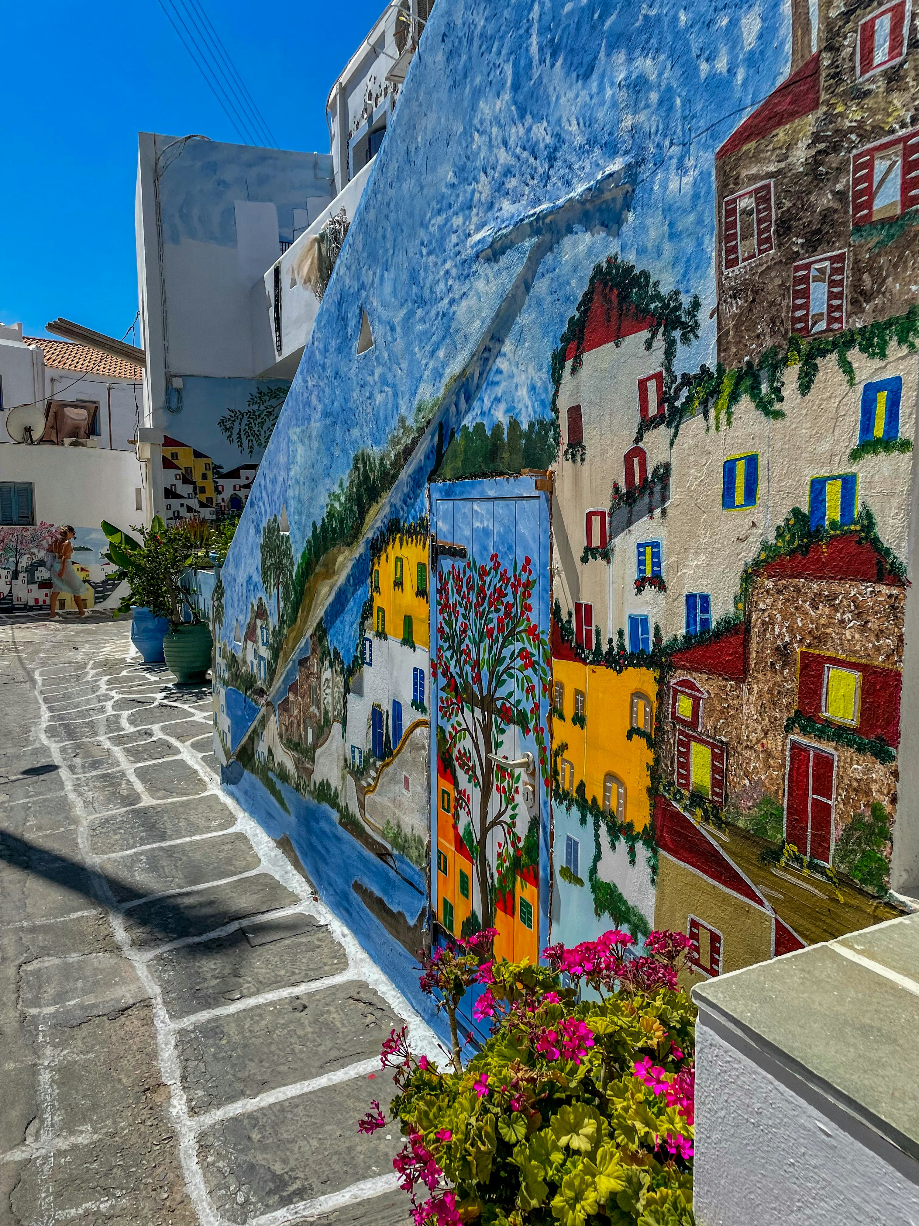 a wall with colorful graffiti