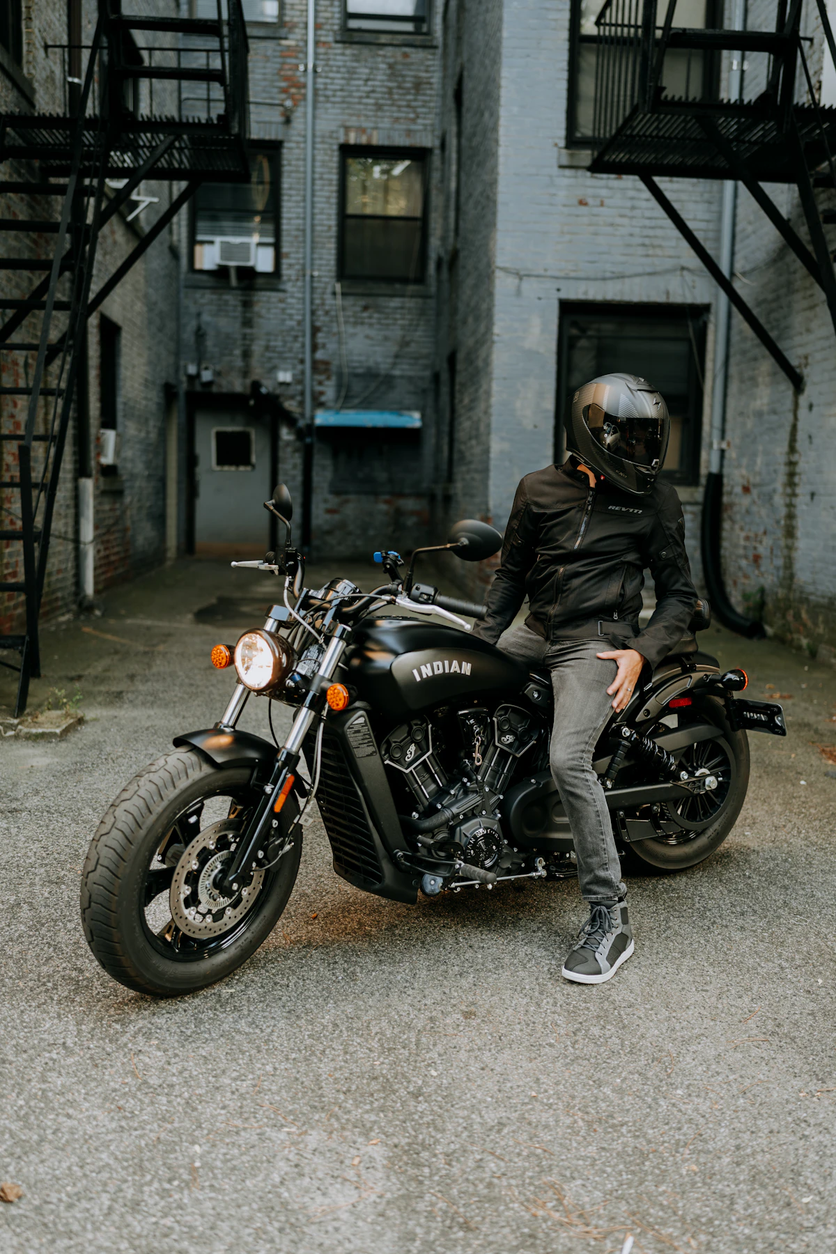 Motorcyclist wearing full riding gear on motorcycle