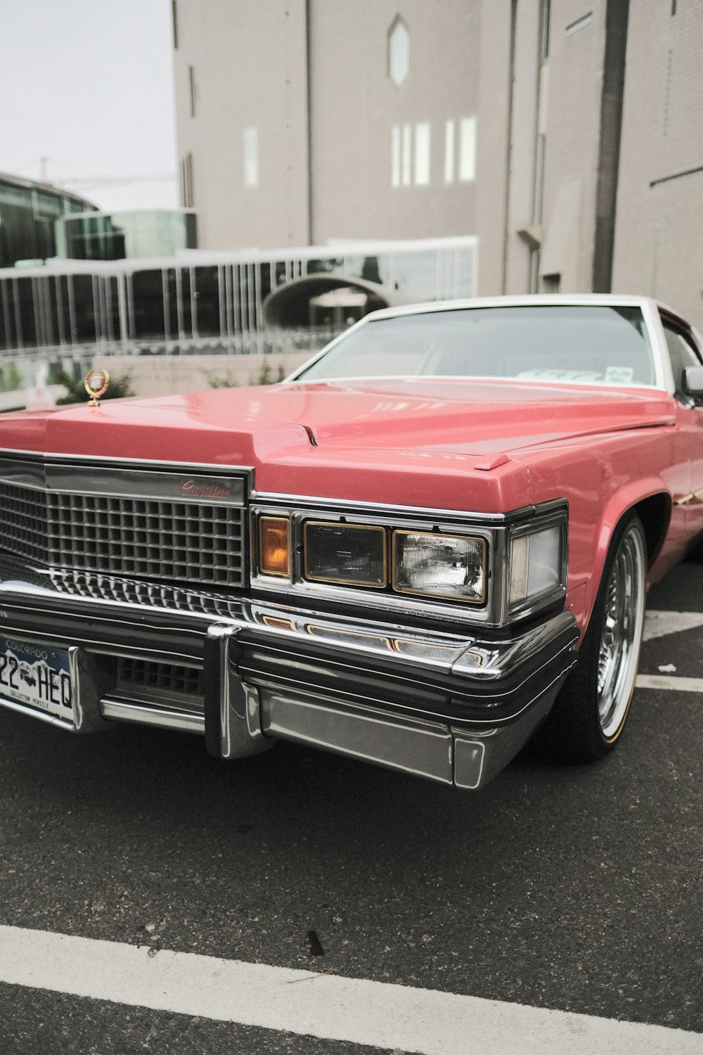 a red car parked in a parking lot