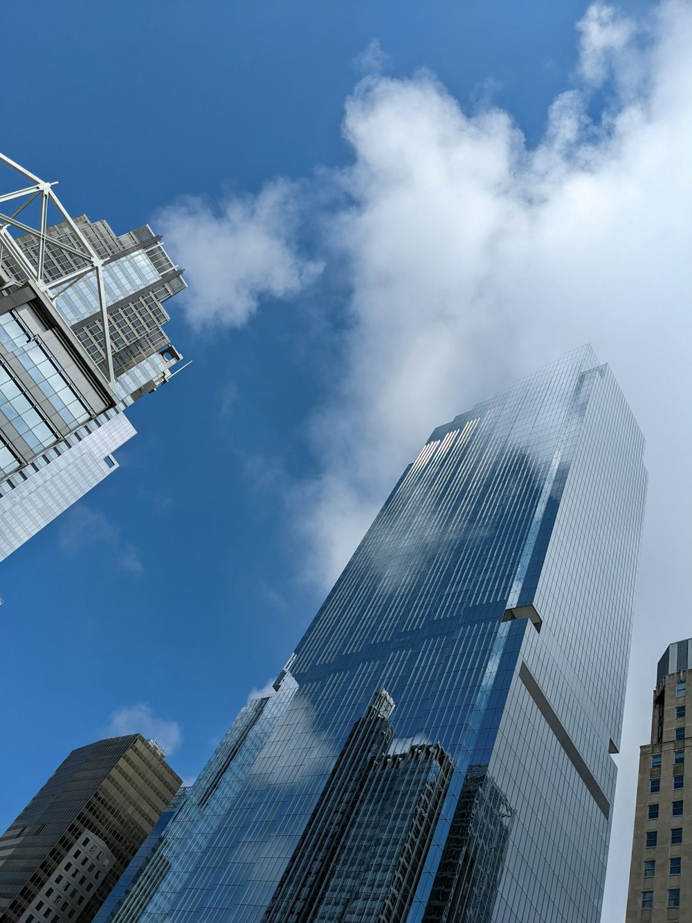 a tall building with a cloudy sky