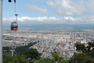 a cable car above a city