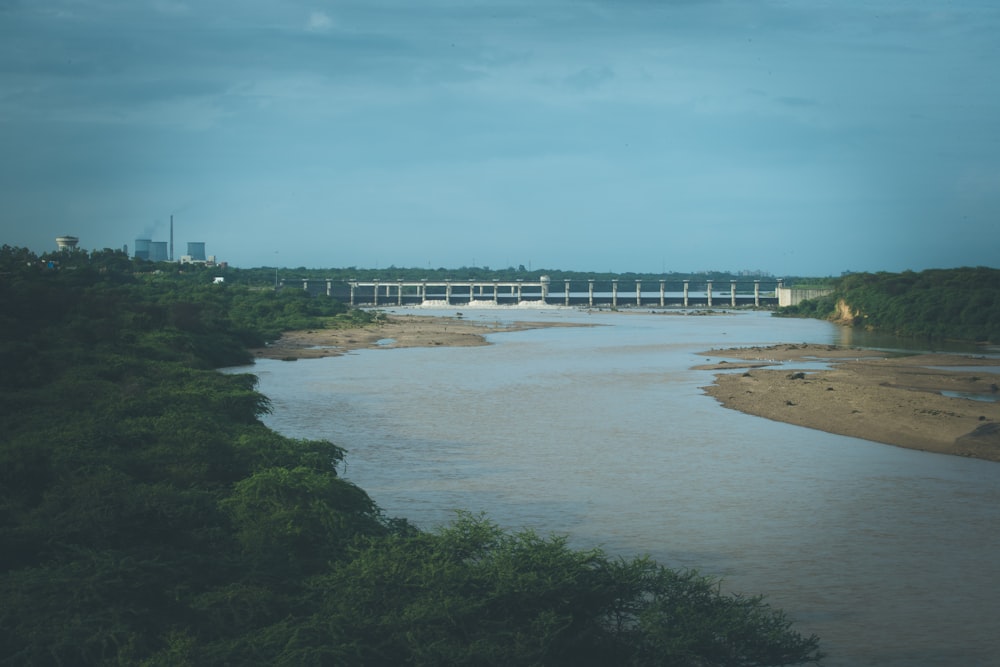 a body of water with a building in the background