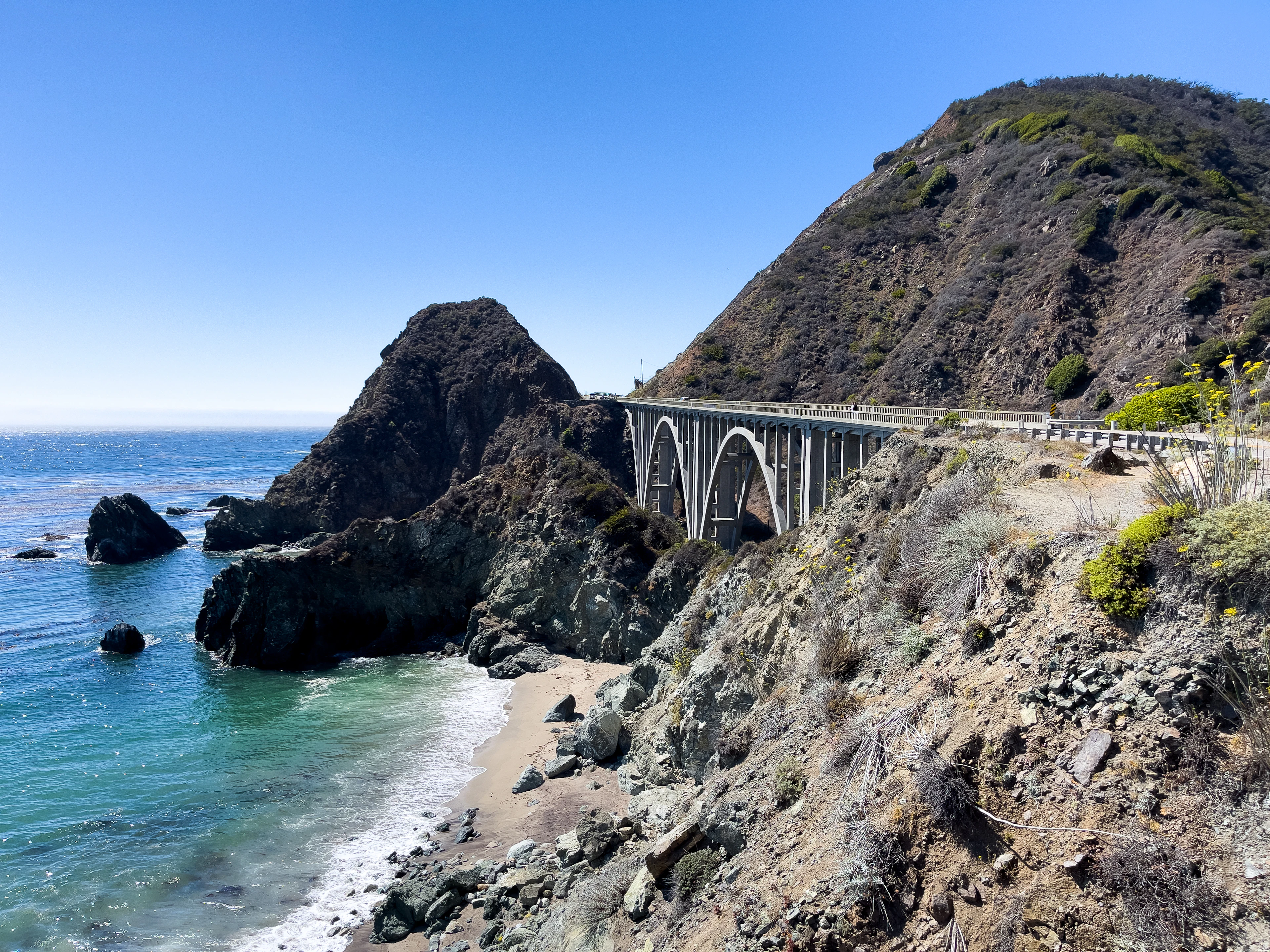Big Creek Bridge in Big Sur, carrying Highway 1 above the rocks and the turquoise Pacific