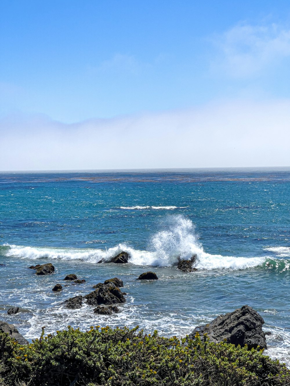 a rocky beach with waves crashing