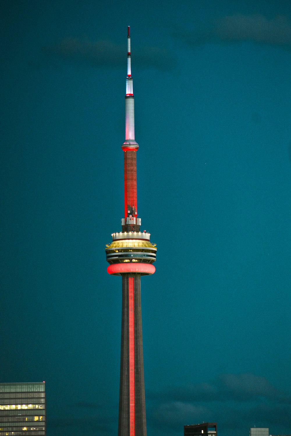 a very tall tower with a clock on it's side